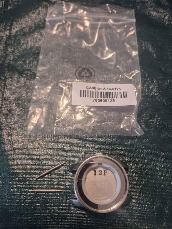 Movado Bold\'s Silver and White Watch Case Back and Pins